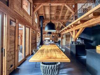 Experience the epitome of luxury living in this stunning property, showcasing exquisite wooden architecture and a spacious, open-plan design.