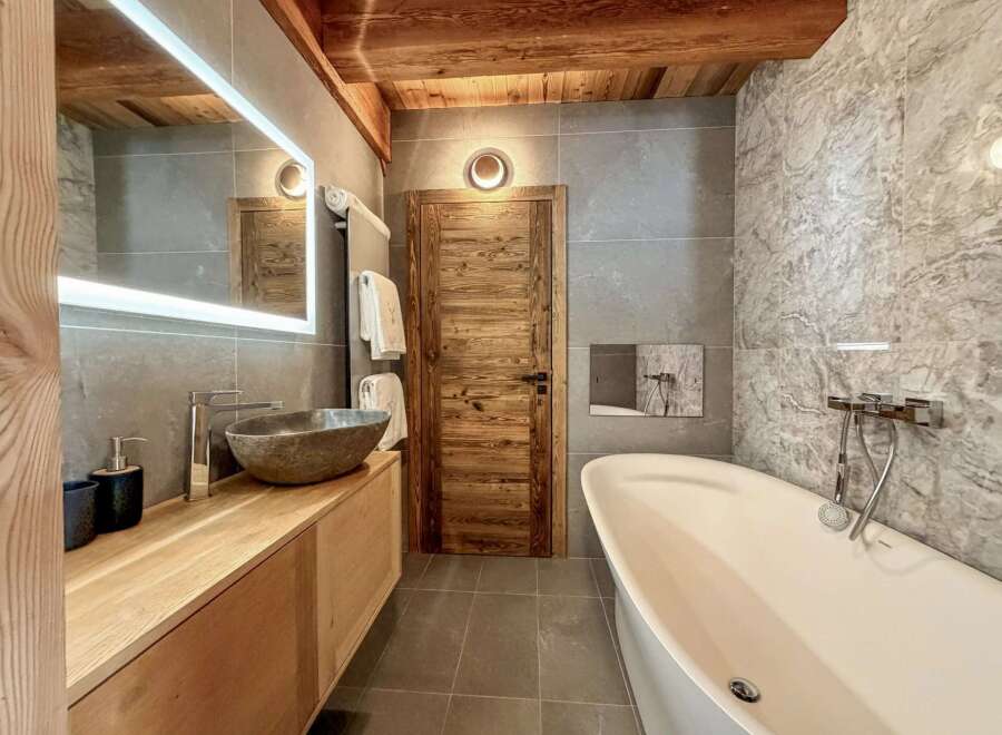 Experience luxury in this stunning bathroom, featuring a sleek, modern design.