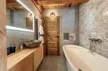 Experience luxury in this stunning bathroom, featuring a sleek, modern design.