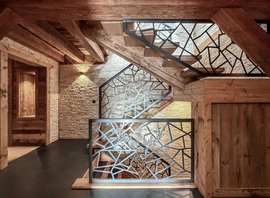 Step into rustic elegance with this stunning property featuring a beautifully crafted staircase.