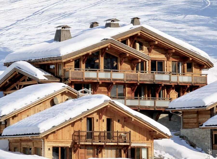 Experience the epitome of luxury living in this stunning chalet nestled in a snowy mountain landscape.