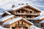 Experience the epitome of luxury living in this stunning chalet nestled in a snowy mountain landscape.