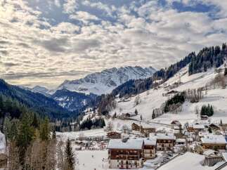 Discover your dream home in this picturesque mountain village! This stunning property boasts breathtaking views of snow-capped peaks and lush forests.