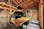 This stunning property boasts a unique architectural design with exposed wooden beams and a loft area, creating a warm and inviting atmosphere.