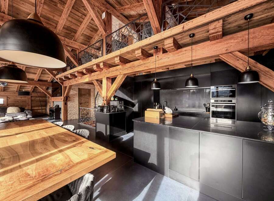 Experience rustic elegance in this stunning property featuring exposed wooden beams and a modern kitchen.