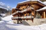Experience the epitome of alpine luxury in this stunning wooden chalet.