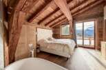 Experience luxury living in this stunning chalet-style bedroom.
