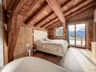 Experience luxury living in this stunning chalet-style bedroom.
