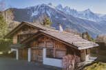 Nestled amidst the majestic mountains, this stunning wooden chalet offers a serene escape.