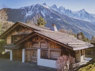 Nestled amidst the majestic mountains, this stunning wooden chalet offers a serene escape.
