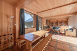 This stunning property boasts a warm and inviting interior with beautiful wooden accents throughout.