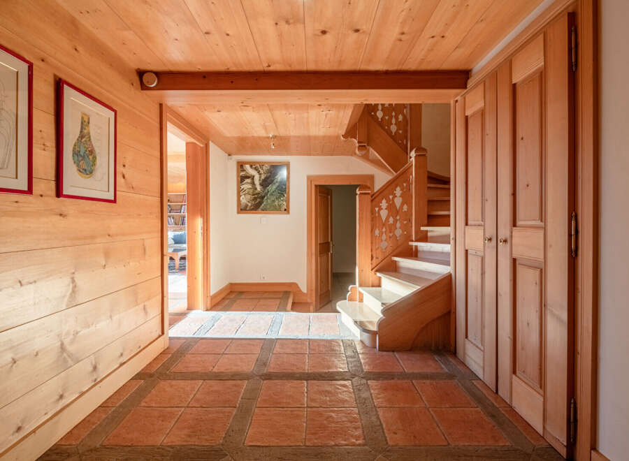 Step into this inviting entryway, showcasing a warm and rustic design.