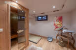 Step into relaxation with this stunning sauna room, perfect for unwinding after a long day.