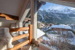 Experience breathtaking mountain views from this charming property.