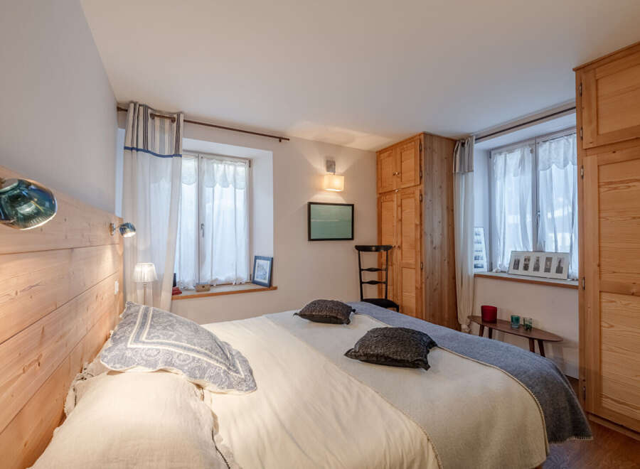 This charming bedroom features a cozy and inviting atmosphere, perfect for relaxation.