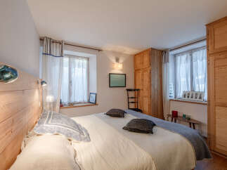 This charming bedroom features a cozy and inviting atmosphere, perfect for relaxation.