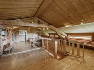 This stunning wooden chalet offers a warm and inviting atmosphere, perfect for a cozy retreat.