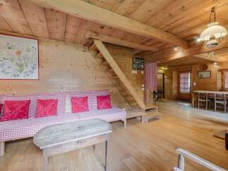 Step into this charming cabin retreat, featuring warm wooden interiors and a cozy atmosphere.