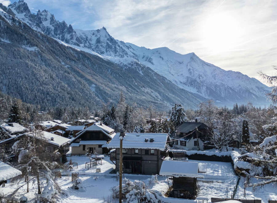 Nestled in a picturesque winter wonderland, this charming property offers stunning views of snow-capped mountains.