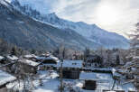 Nestled in a picturesque winter wonderland, this charming property offers stunning views of snow-capped mountains.