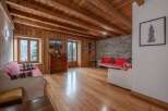 This stunning property boasts a warm and inviting interior with beautiful wooden floors and ceilings.