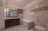 Step into this elegant bathroom featuring classic design elements and luxurious finishes.