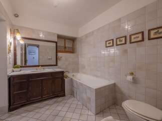 Step into this elegant bathroom featuring classic design elements and luxurious finishes.