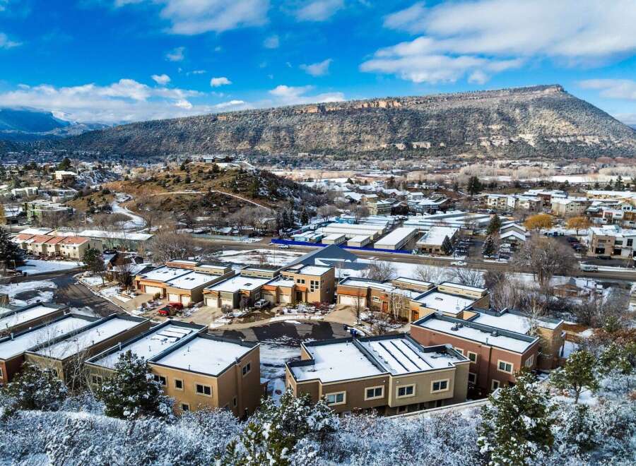 Discover a stunning property nestled in a picturesque winter landscape, offering modern living with breathtaking mountain views.