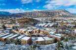 Discover a stunning property nestled in a picturesque winter landscape, offering modern living with breathtaking mountain views.