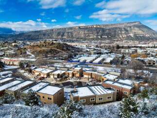Discover a stunning property nestled in a picturesque winter landscape, offering modern living with breathtaking mountain views.