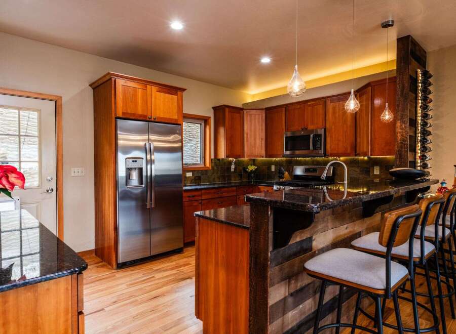 This stunning kitchen boasts a modern design with a touch of rustic charm.