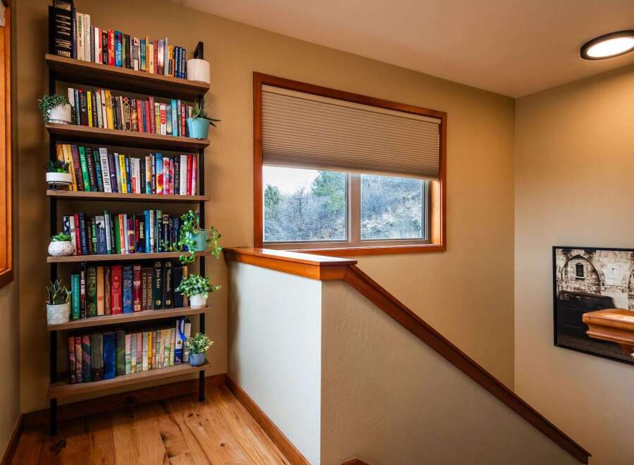 This stunning property boasts a beautifully designed staircase leading to a cozy reading nook.