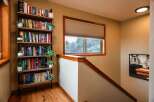 This stunning property boasts a beautifully designed staircase leading to a cozy reading nook.