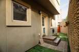 Discover the charm of this property, featuring a welcoming entrance with a wooden deck and steps.