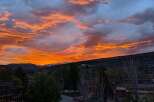 Enjoy breathtaking sunsets from this stunning property! This home offers panoramic views of the mountains and vibrant skies.