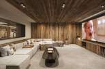 Experience luxury living in this stunning home theater! Featuring a cozy sectional sofa, a large screen for movie nights, and a stylish wooden ceiling, this space is perfect for relaxation and entertainment.