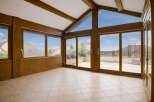 Step into this sun-drenched room with expansive windows that offer stunning views and flood the space with natural light.