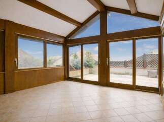 Step into this sun-drenched room with expansive windows that offer stunning views and flood the space with natural light.