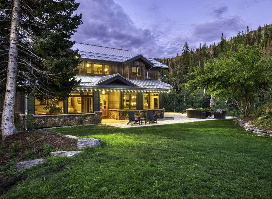 This stunning mountain home offers a perfect blend of rustic charm and modern luxury.