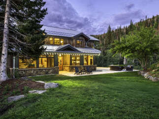 This stunning mountain home offers a perfect blend of rustic charm and modern luxury.