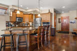 This stunning kitchen boasts beautiful wooden cabinetry and a spacious island, perfect for entertaining.