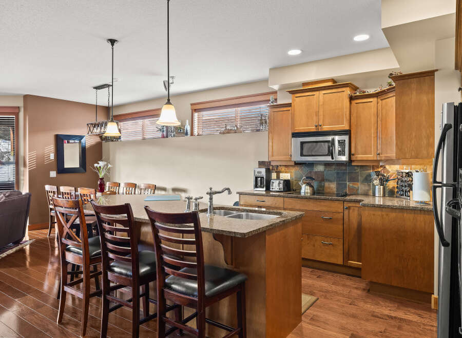 This stunning kitchen boasts a spacious island with seating, perfect for entertaining or casual dining.