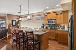 This stunning kitchen boasts a spacious island with seating, perfect for entertaining or casual dining.