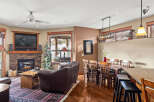 Step into this inviting living space, featuring a cozy fireplace and a stylish entertainment center.