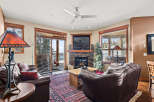 Step into luxury with this stunning living room, featuring a cozy fireplace and elegant leather seating.