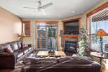 This cozy living room features a beautiful stone fireplace, perfect for those chilly evenings.