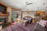 This stunning property boasts a cozy living room with a stone fireplace, perfect for those chilly evenings.