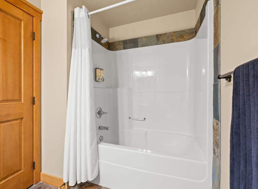 Step into a clean and inviting bathroom space.