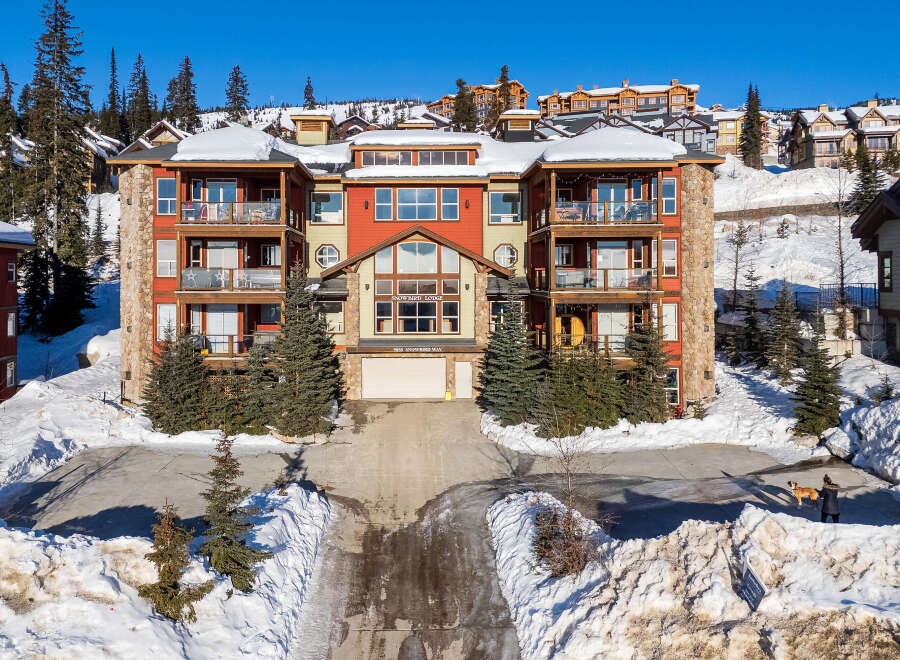 Discover luxury living at Snowbird Lodge, a stunning property nestled in a winter wonderland.