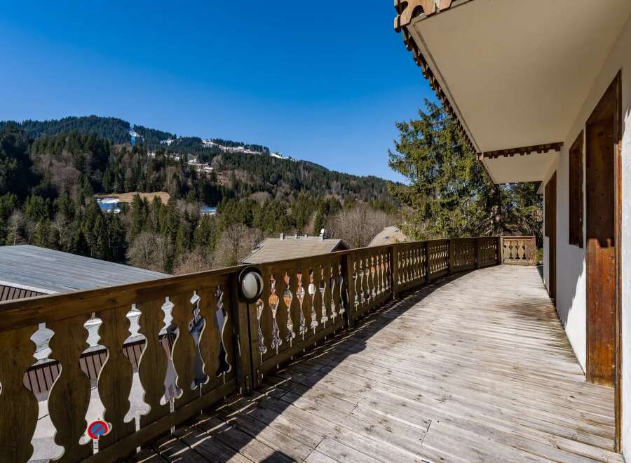 Enjoy breathtaking mountain views from this charming balcony.